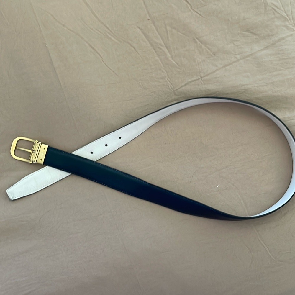 Women’s Christian Dior reversible belt, navy blue, and white with gold buckle.